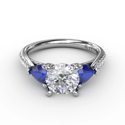 Elegant Pear Sidestone Ring in Sapphire