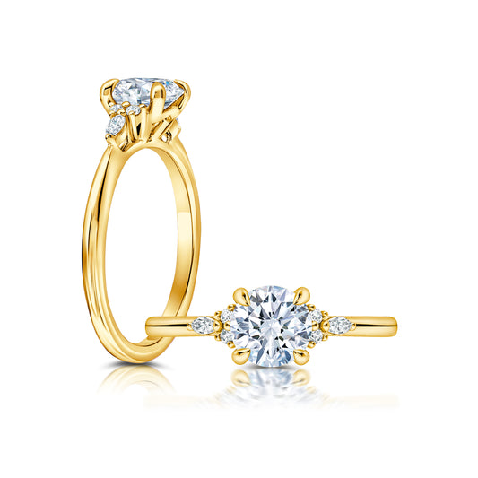 Three Stone set with Marquise Diamonds on each side of the center