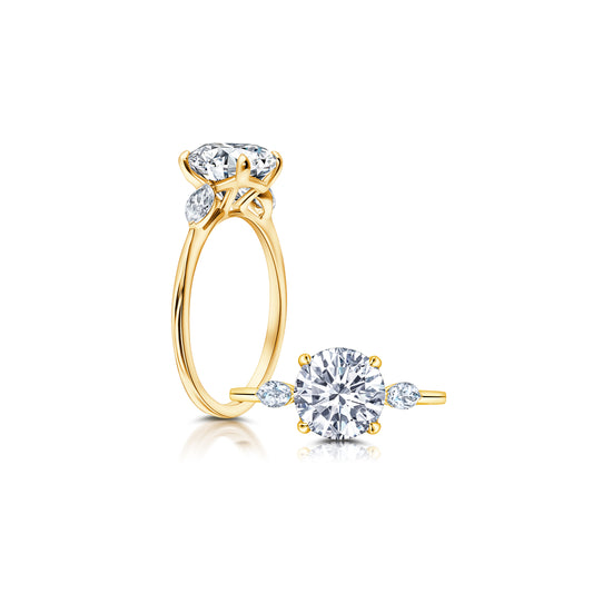 Three Stone set with Marquise Diamonds on each side of the center
