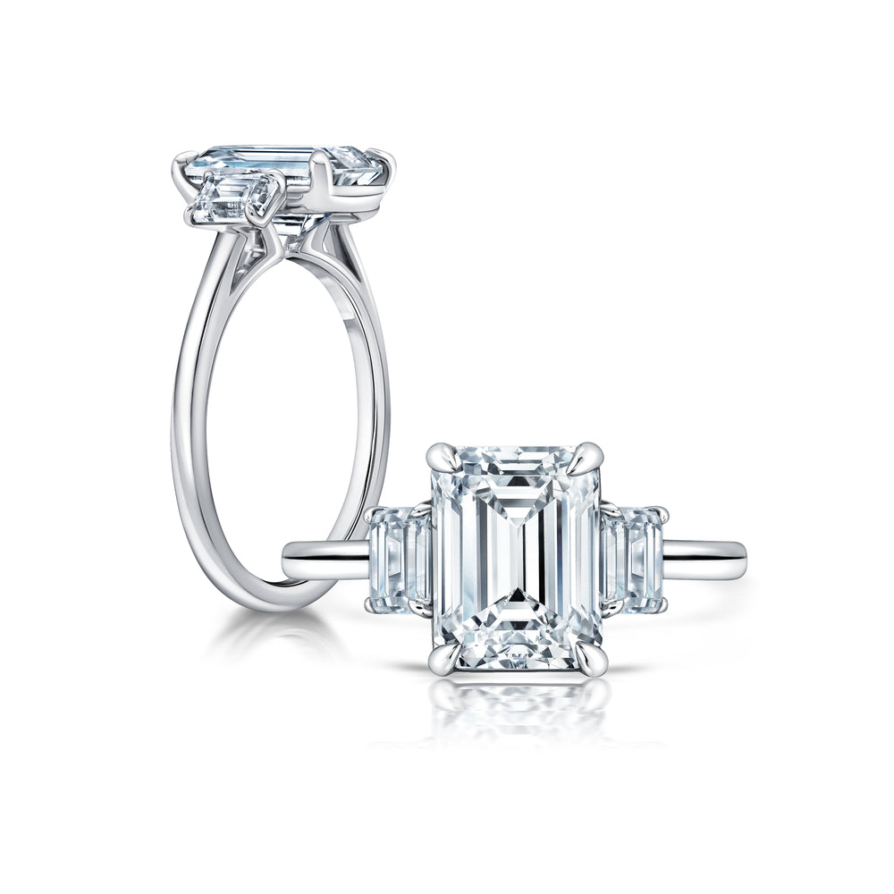 Three stone Emerald cut ring with peekaboo shank